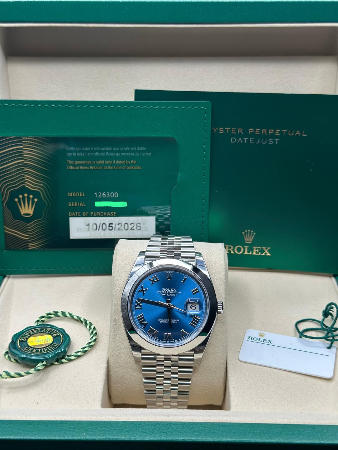 May be an image of wrist watch and text that says 'DATEJUST MODE RO 10/05/2026 ROLEX ROLEX LEX ኃ. TORETTY I X X III 6 អស 電 AI งกีม- ROLEX EX ROL'