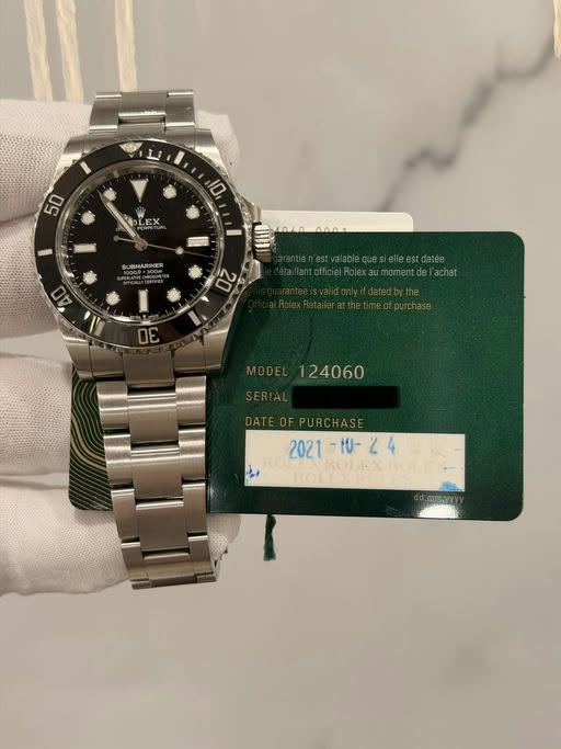 May be an image of wrist watch and text that says '50 10 LEX SUBMARING yi 20 σE - ROLEXII'