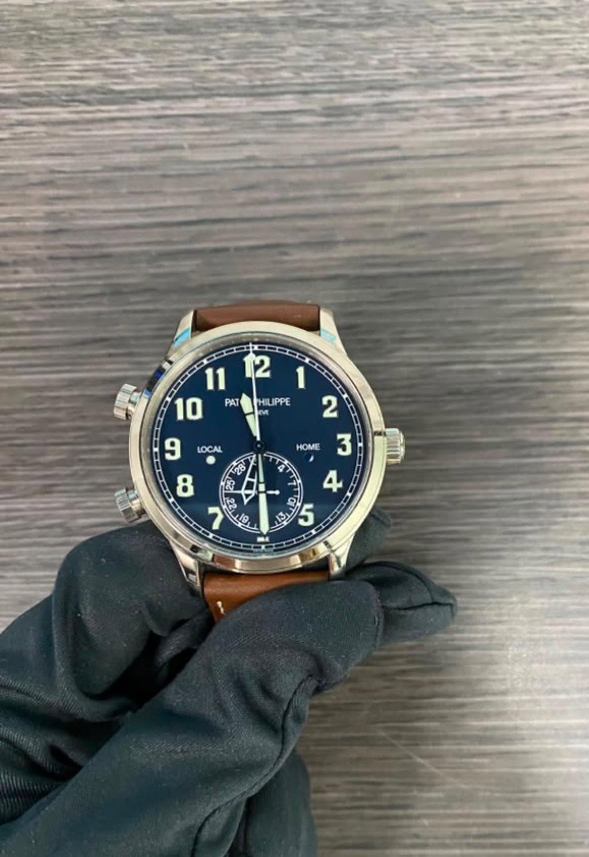 May be an image of wrist watch and text that says '2 11 10 PAT LOCAL 9 HOME 1 HILIPPE 2 3 4 A a س 8 + '