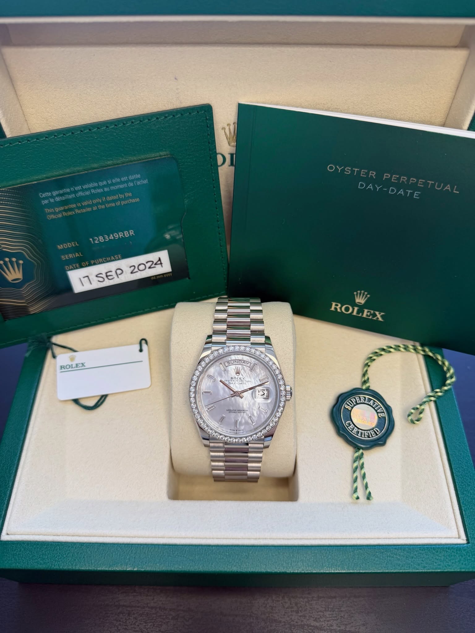 May be an image of wrist watch and text that says '双物d.m果 OYSTERPERP OYSTER DAY-DATE DA -DATE 128349RBR 17SEP2024 17SEP ١٦ SEP 2024 ROLEX ROLEX ١ 1 s 3 M2LG AULRLNTIE CERTETED'