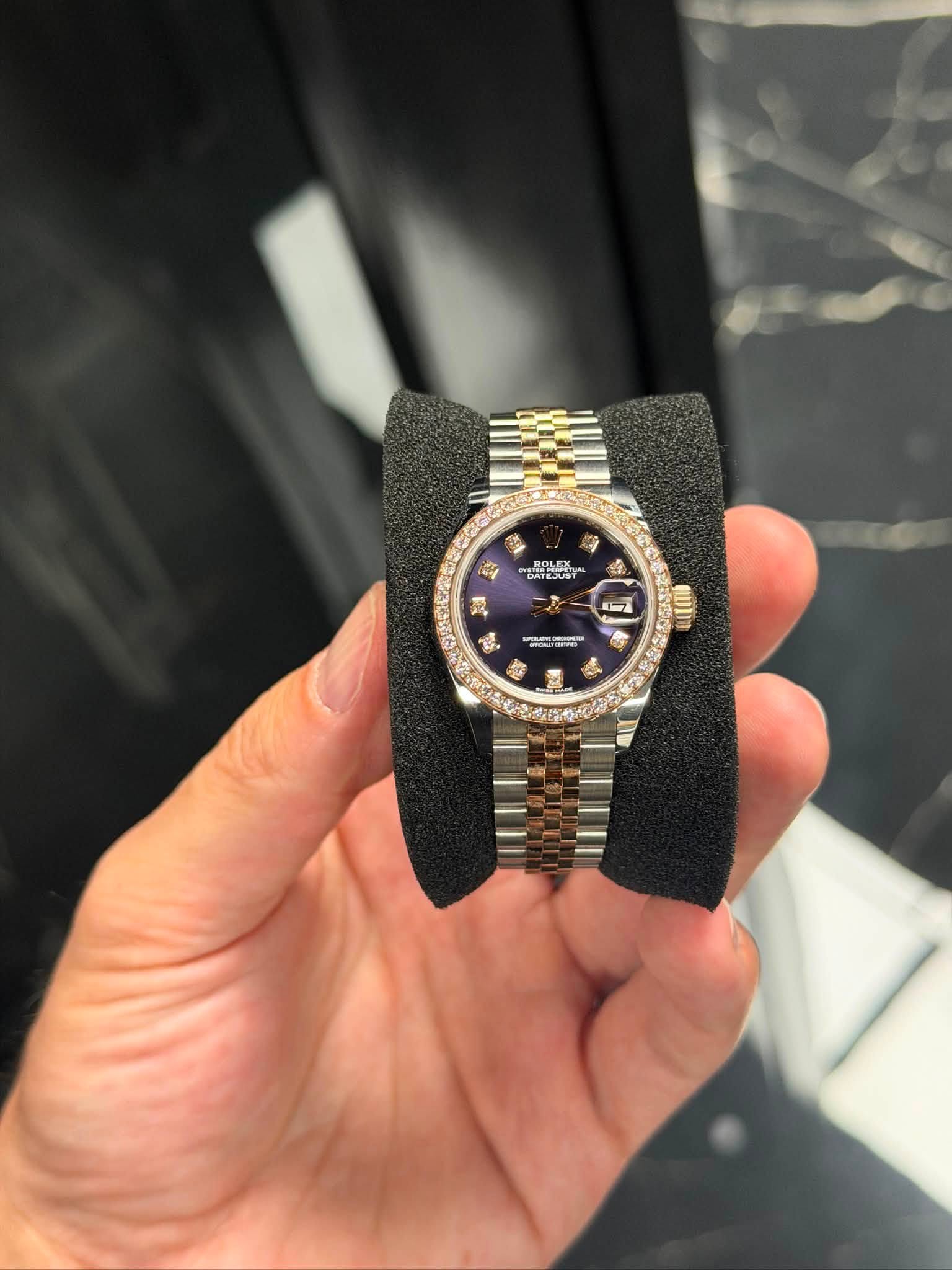 May be an image of wrist watch and text