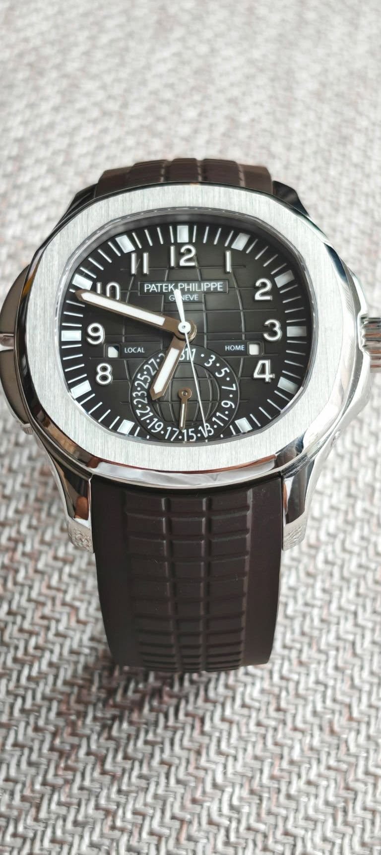 May be an image of digital watch and text that says '12 II ባ PATEK.PHILIPPE PATEK NEVE 2 3 HDME 4 9 LOCAL ن'