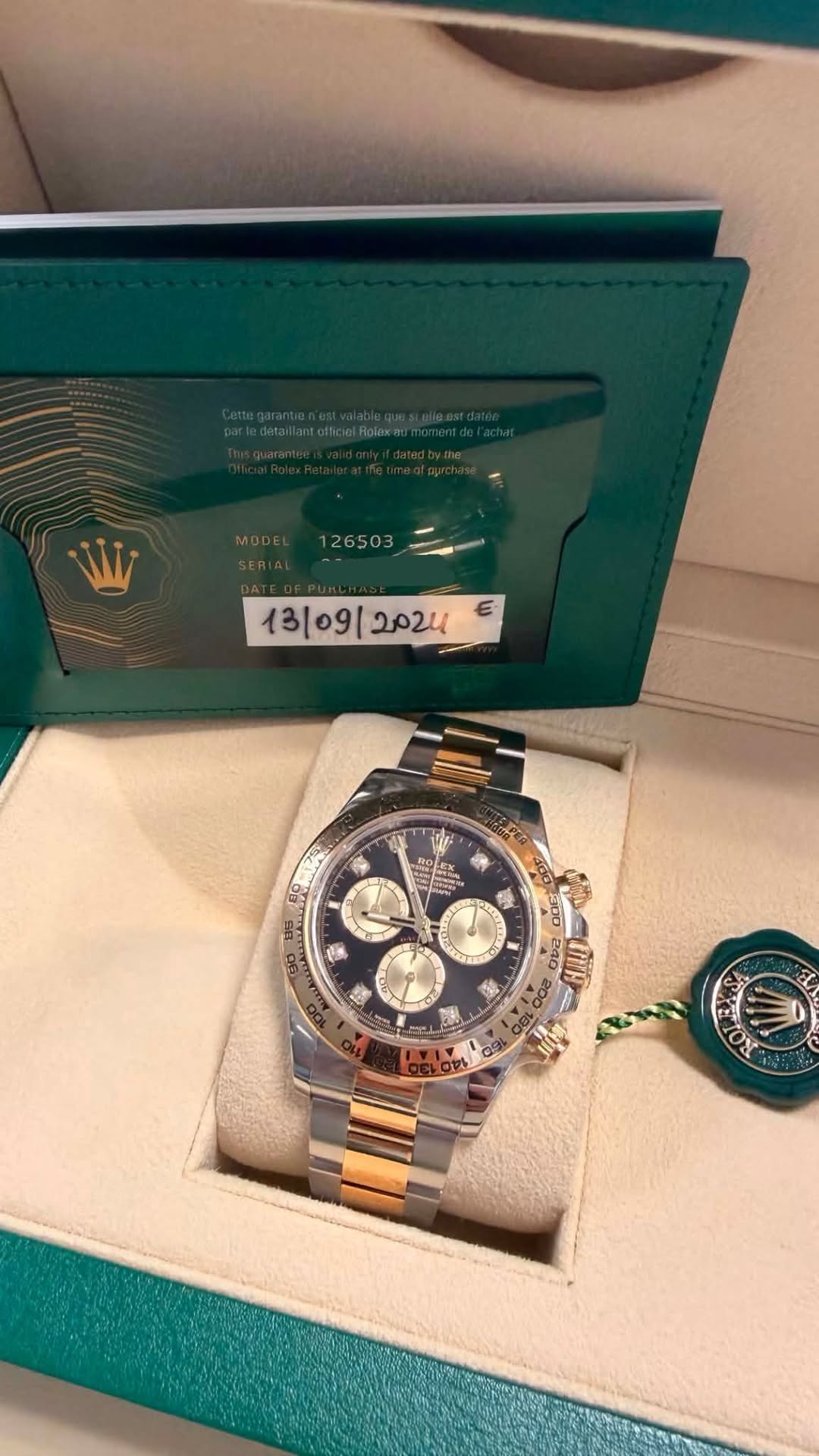 May be an image of wrist watch and text that says '26503 E 13/09/ 夏 茶 5 ロ デ 240 በ'
