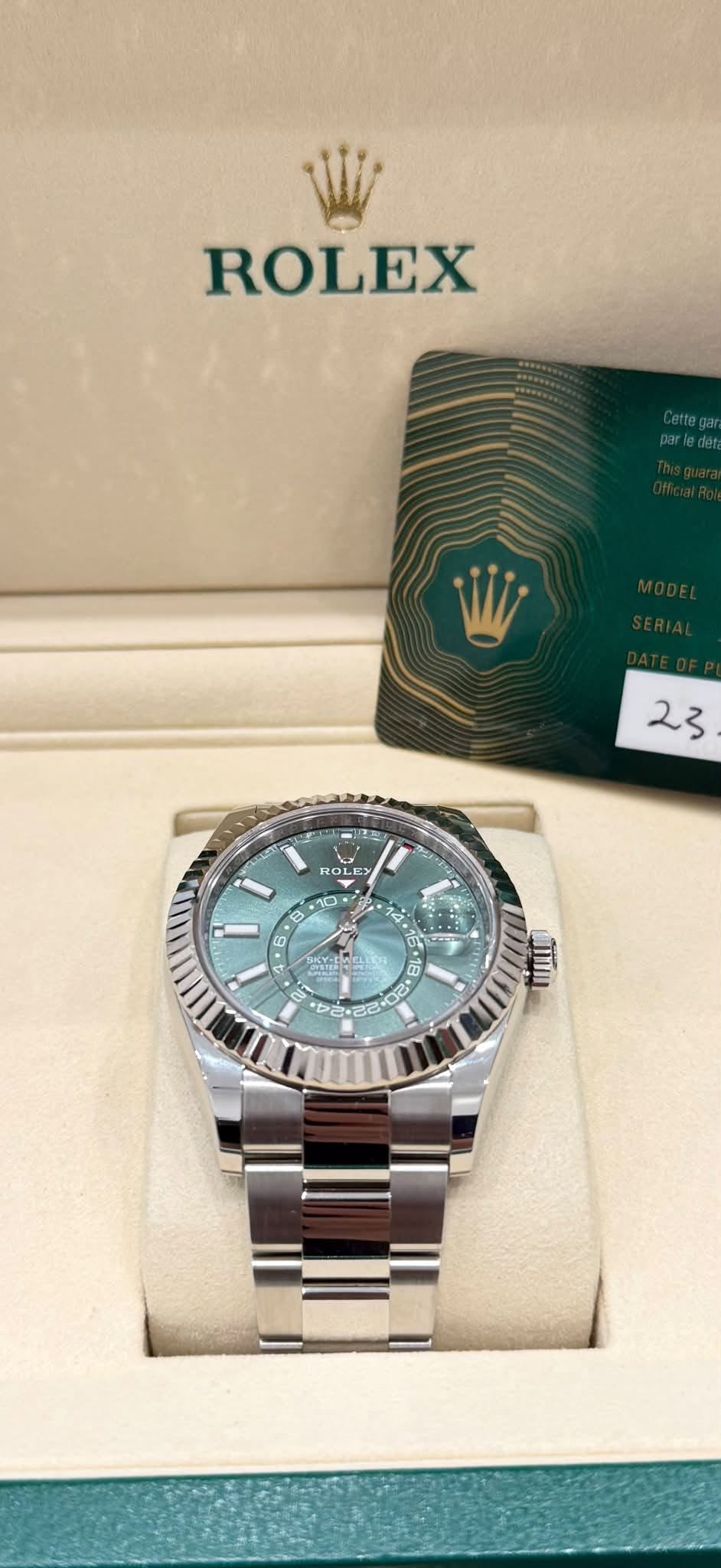May be an image of wrist watch and text that says 'ROLEX 23 ROLEY + -10 10 : 8 6 4 4'
