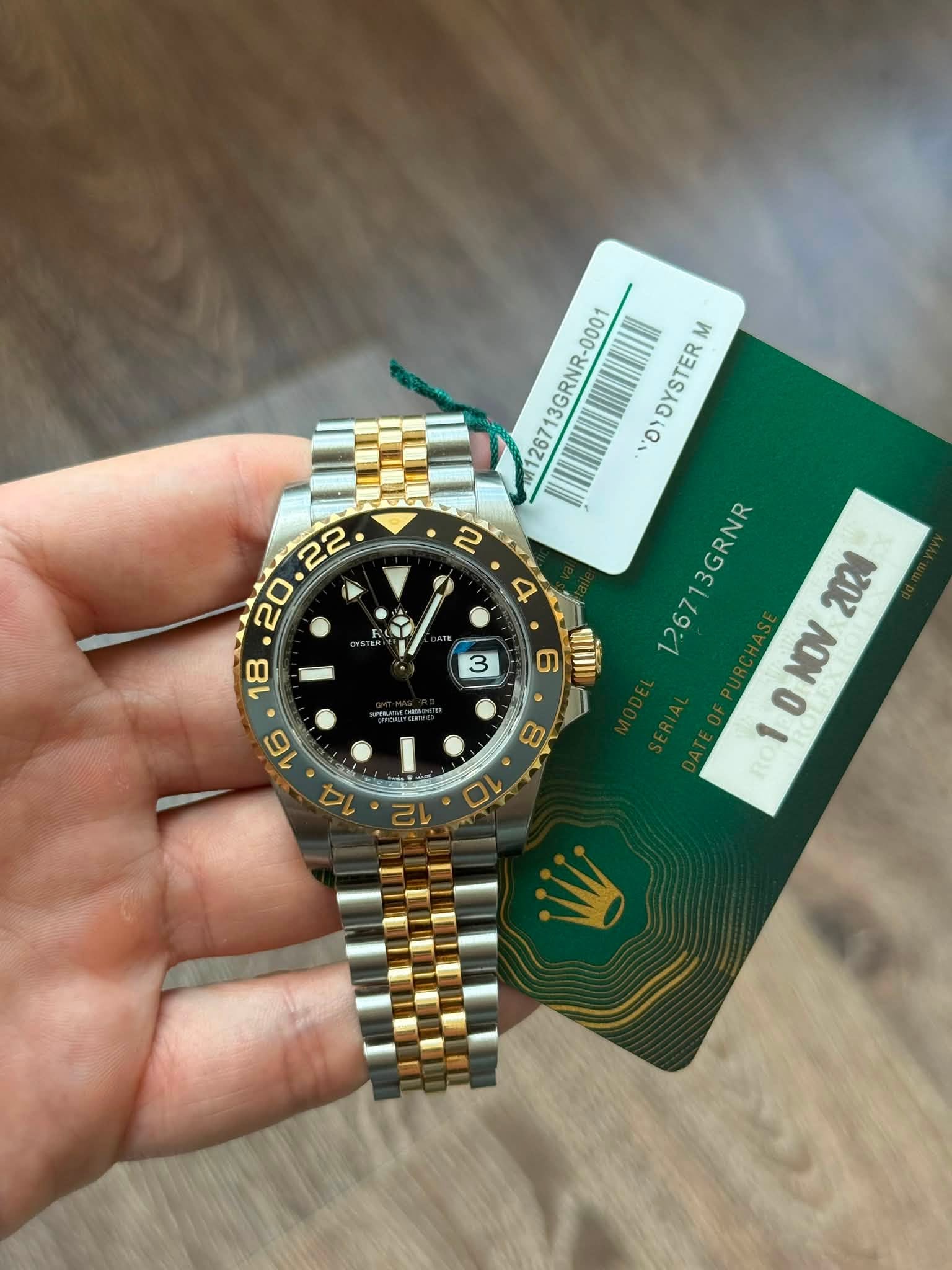 May be an image of wrist watch and text that says ' 126713GRNR-0001 อ OYOYSTER -0001 M N D 126713 26713GRNR GRNR 2024 10NOV 1 NOV O RO 3 9 HIL! 16 14 o0 8 10 12'