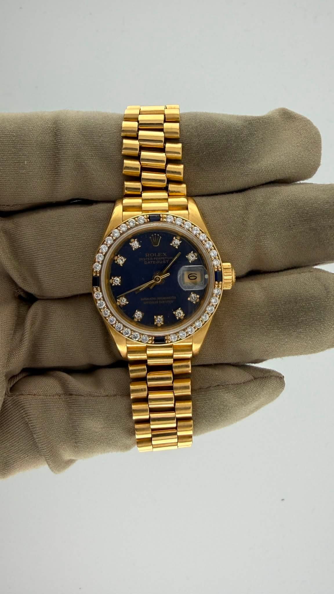May be an image of wrist watch and text