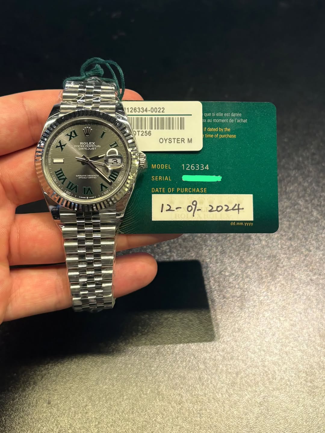 May be an image of wrist watch and text that says ' ROLEX 3DT256 T256 ques siellee datée latd Xau momentdaach 'achat datedby.the the time purchase 45 - OYSTER M SIE া3 በጋና 15C…