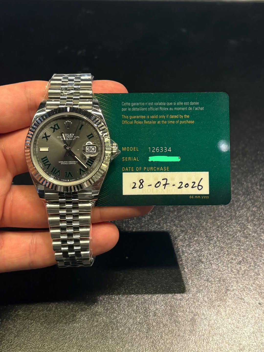 May be an image of wrist watch and text