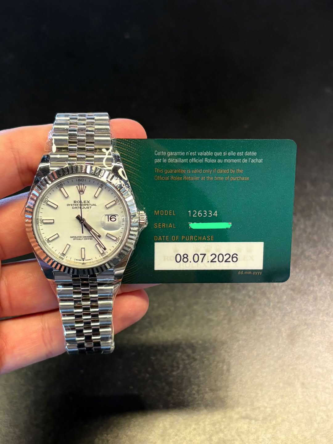 May be an image of wrist watch and text