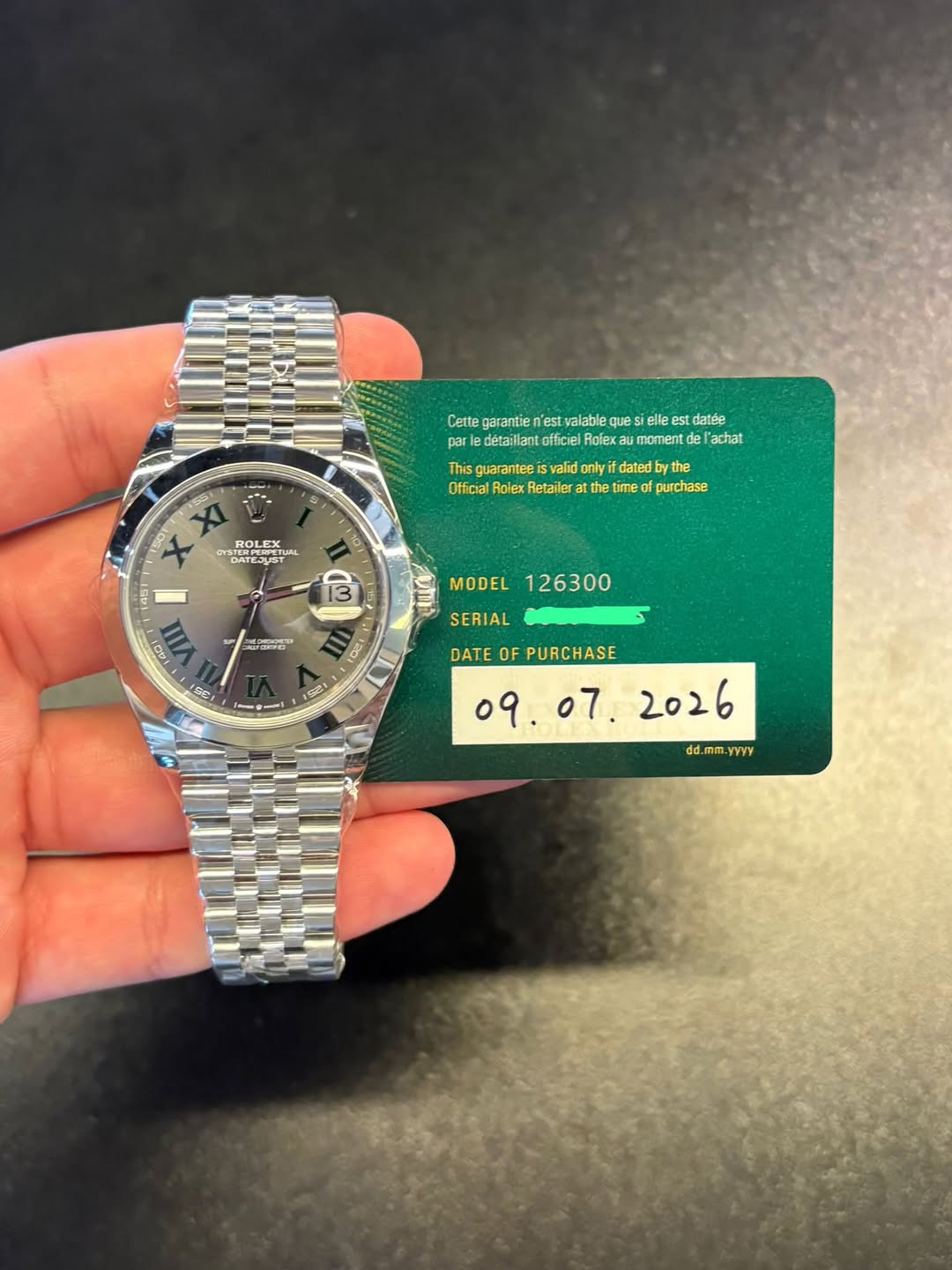 May be an image of wrist watch and text that says 'SS Cette garantie n'est valable que elle es est datée detaillant officiel Rofex momer achat This guarantee lidonly only datedby…