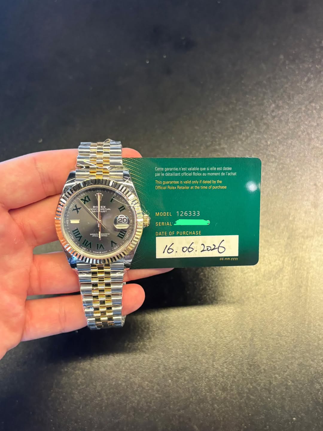 May be an image of wrist watch and text