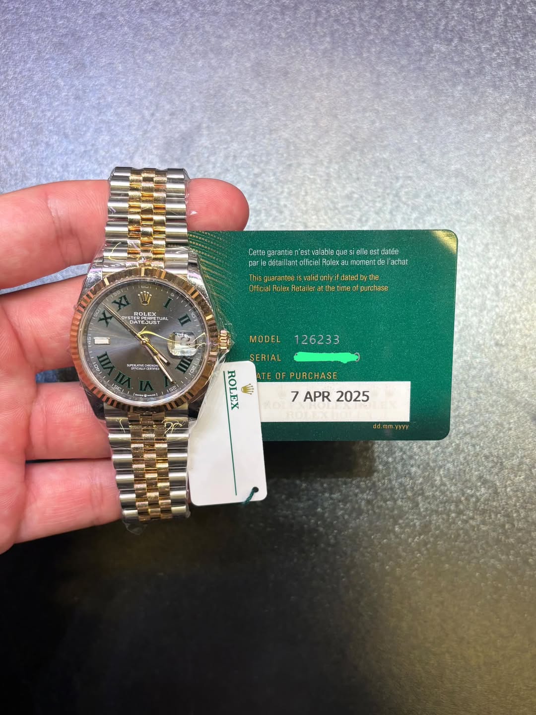 May be an image of wrist watch and text