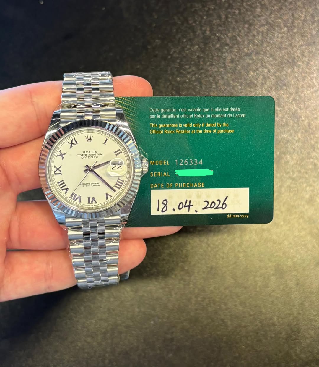 May be an image of wrist watch and text