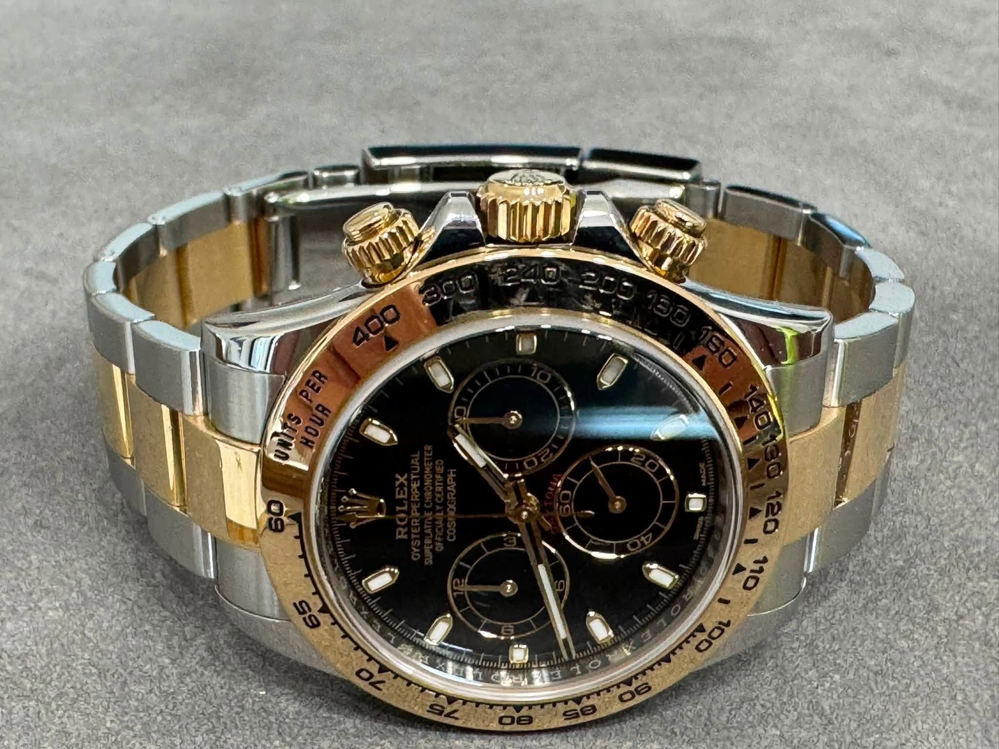 May be an image of wrist watch and text
