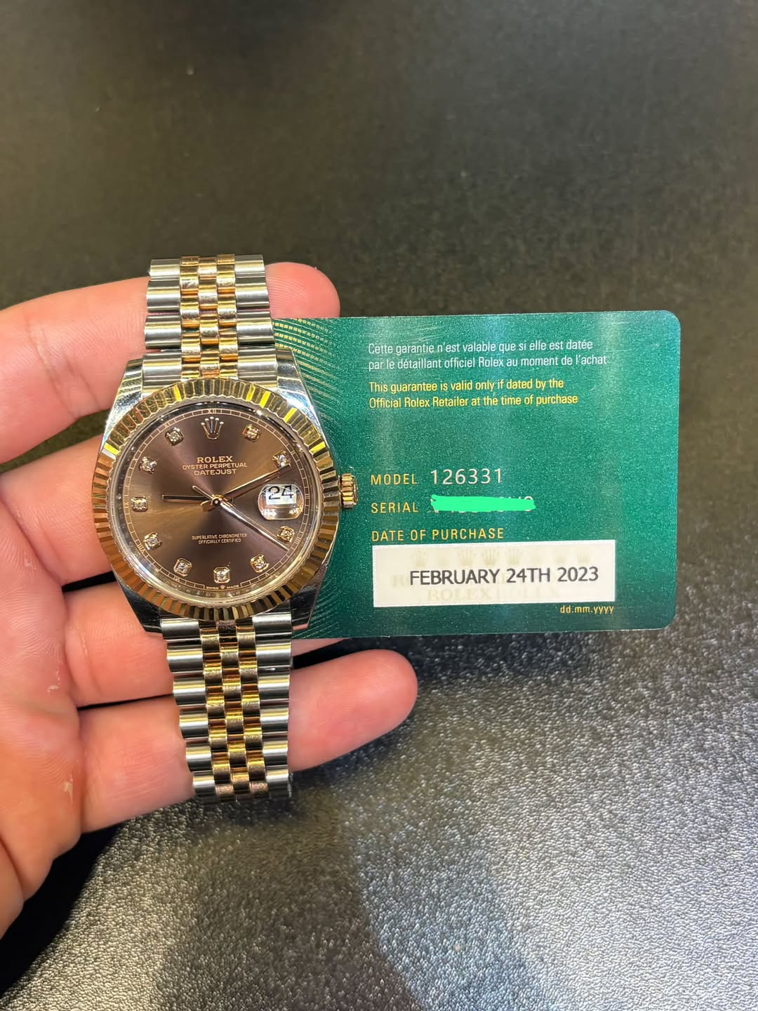May be an image of wrist watch and text