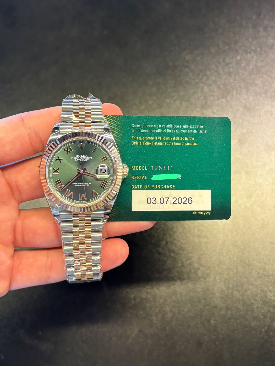 May be an image of wrist watch and text