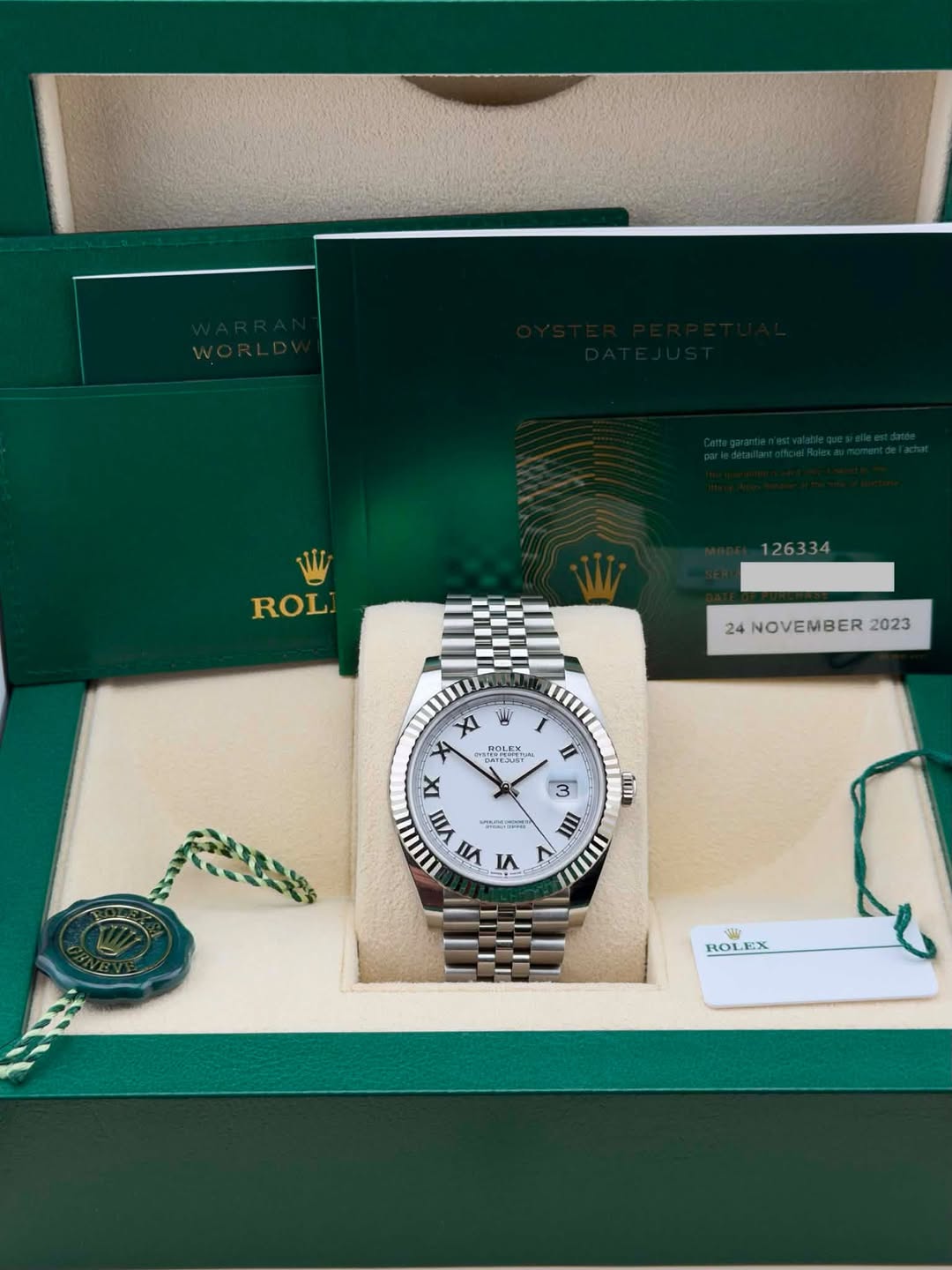 May be an image of wrist watch and text that says 'ROL 126334 24NOVEMBER2023 24 NOVEMBER 2023 Xl 빵 Χ TOLEX nTPPCHETИ IX VIII ריפת かム 5 VI I II 3 ممت IIII mII i ROLEX የ፡ ROL'