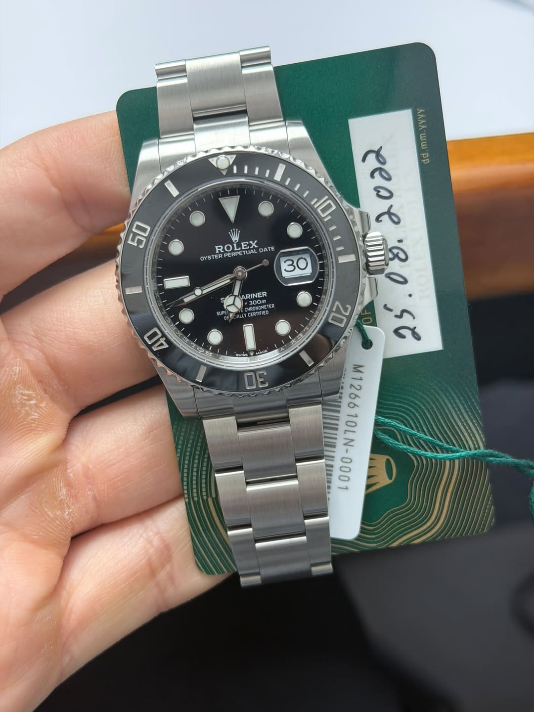 May be an image of wrist watch and text
