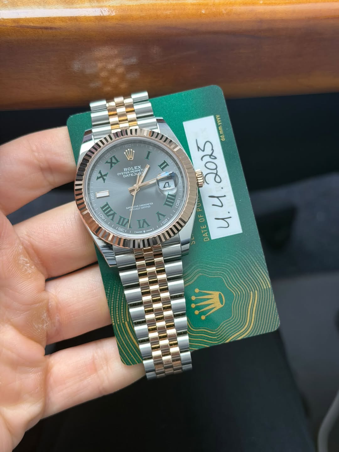 May be an image of wrist watch and text