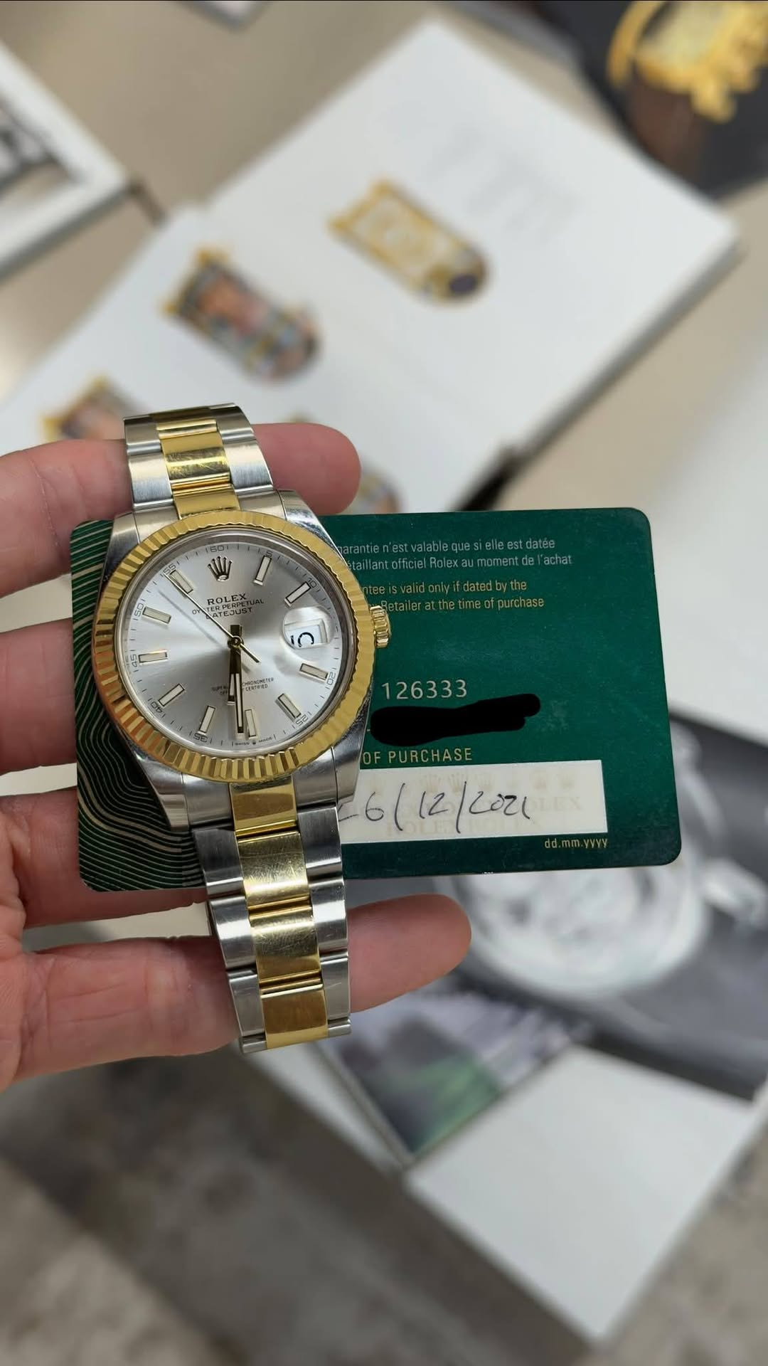 May be an image of wrist watch and text