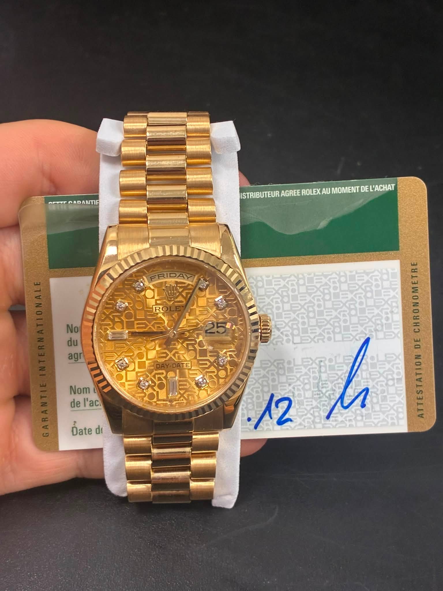 May be an image of wrist watch and text