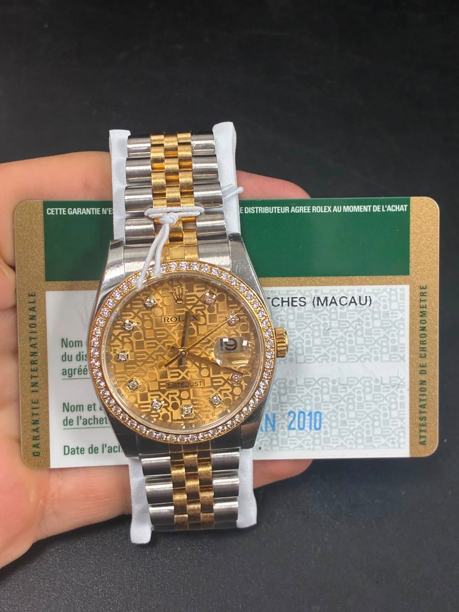 May be an image of wrist watch and text