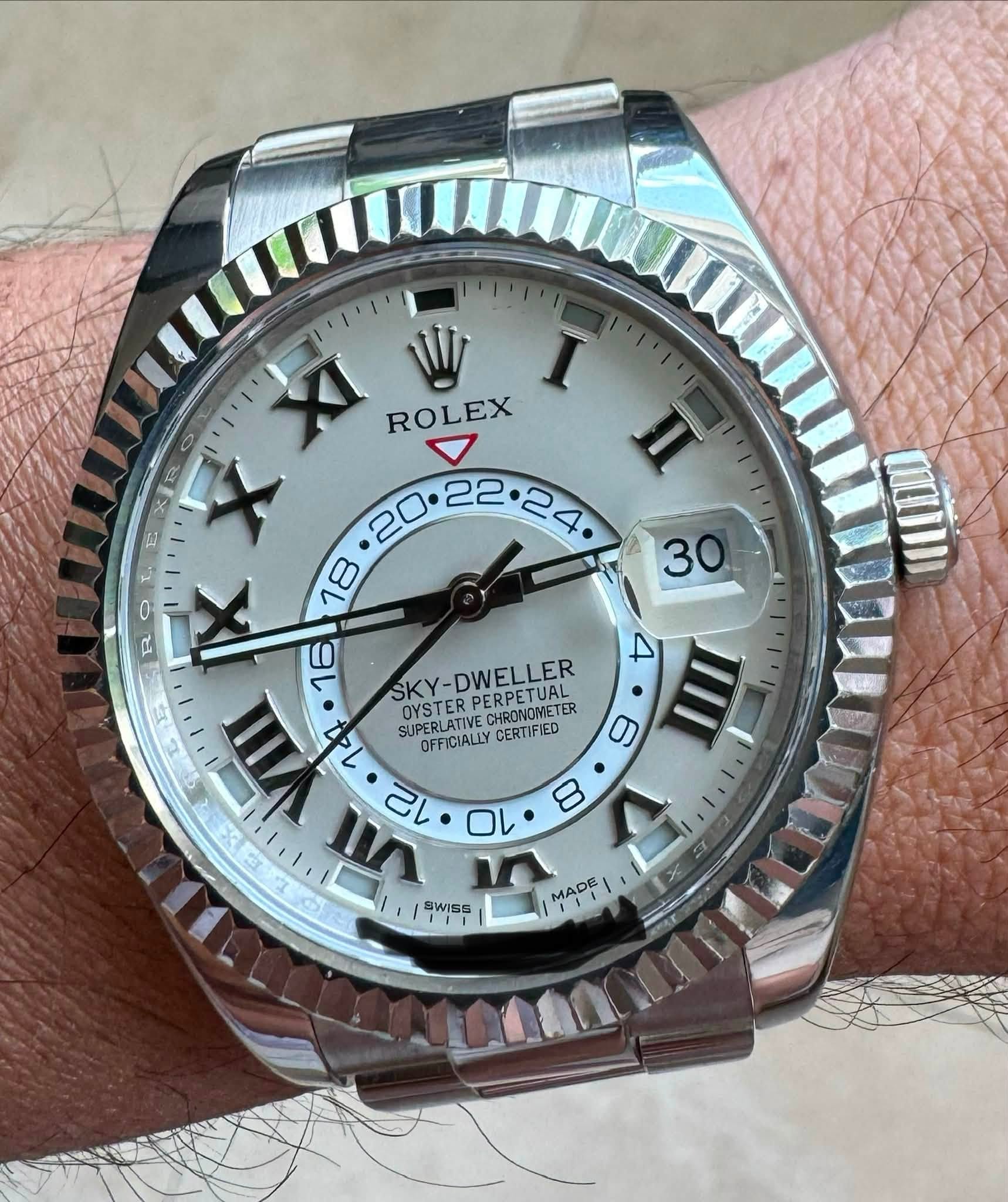 May be an image of wrist watch and text that says '3 XI ROLEX n E R X ٠ ٥ 18 R 16 4 III SKY- SKY-DWELLER VIII J 12 OYSTER PERPETUAL 147 OYSTERPERPETUAL SUPERLATIVECHRONORETER 9…