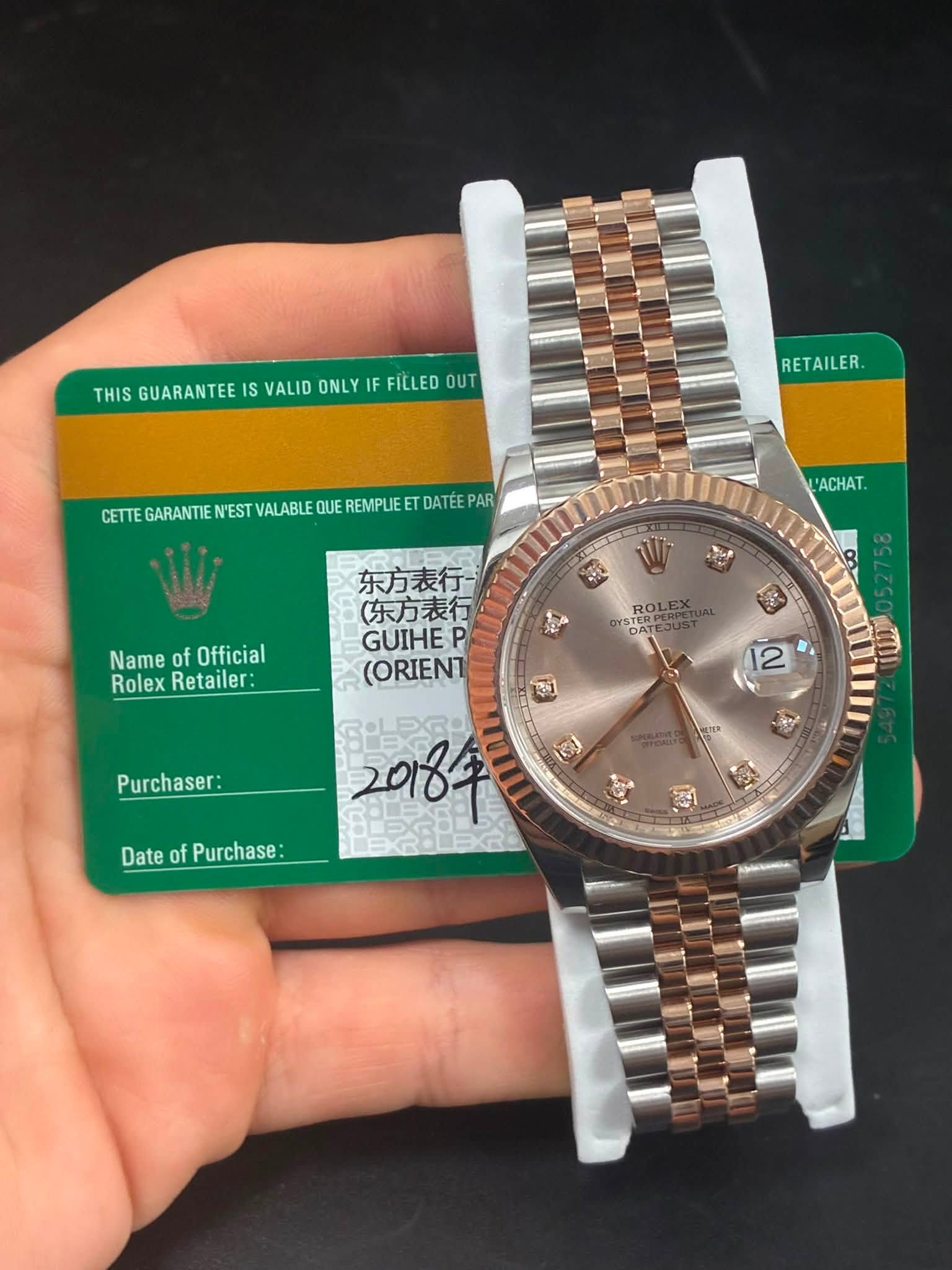 May be an image of wrist watch and text that says 'THIS GUARANTEE IS VALID ONLY IF FILLED OUT RETAILER. CETTE GARANTIE N'EST VALABLE QUE REMPLIE L'ACHAT. Name of Official Rolex…