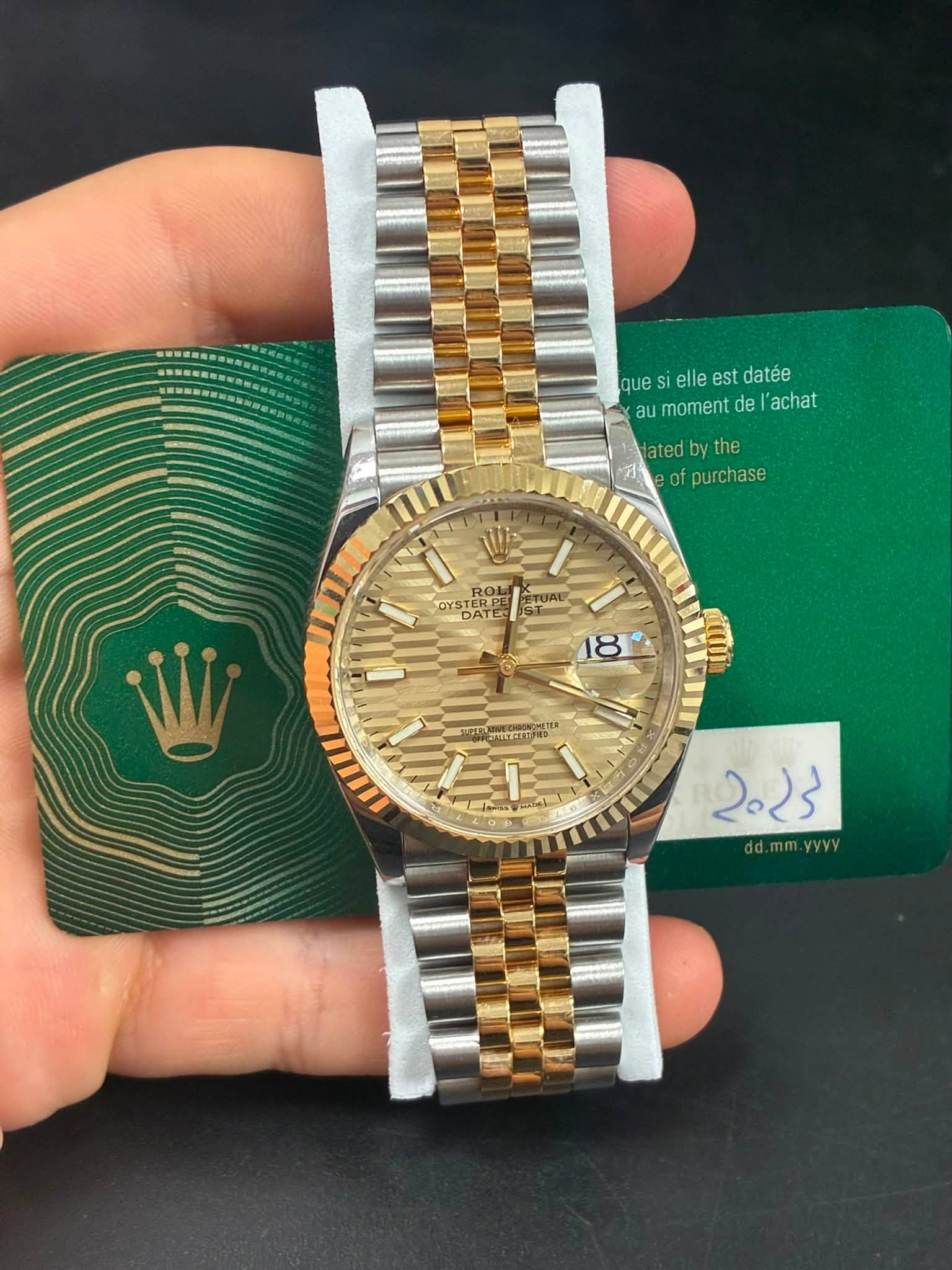 May be an image of wrist watch and text
