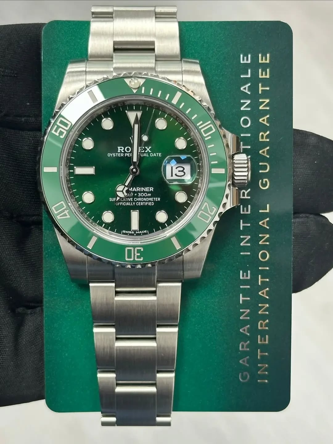 May be an image of wrist watch and text that says '50 RO OYSTERPER かX UALDATE UAL DATE 13 MARINER SUF JFZLATIVE PUSDNMETE CHRONDMETER FFICIALLY CERTIFIED 40 10 IIITIONALE 20 Wss…