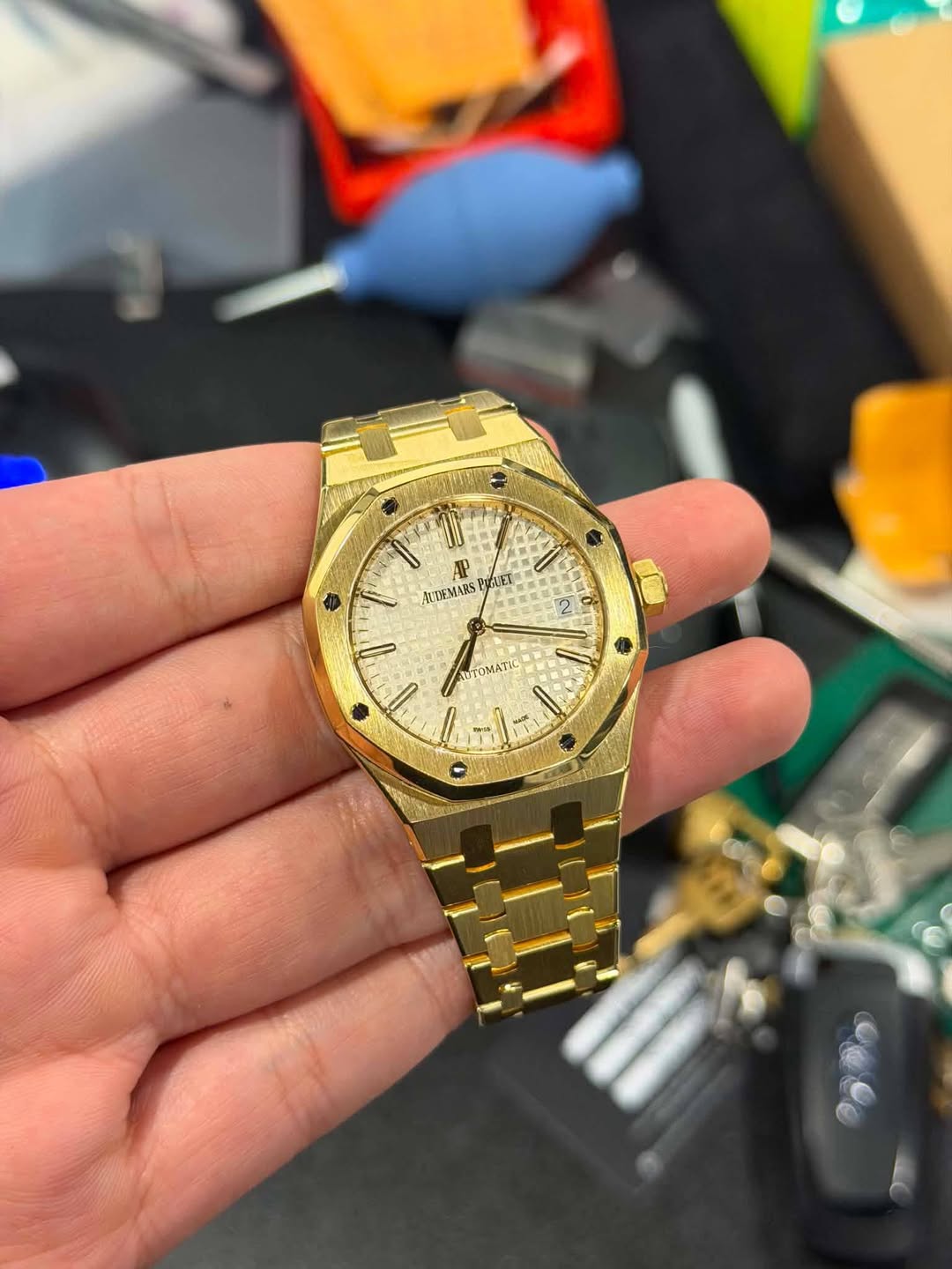 May be an image of wrist watch and text