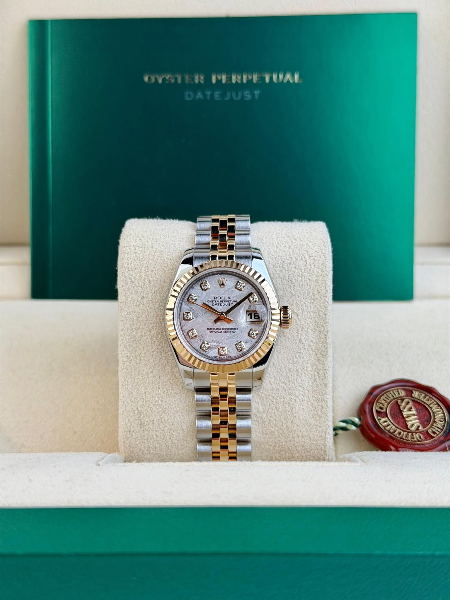 May be an image of wrist watch and text