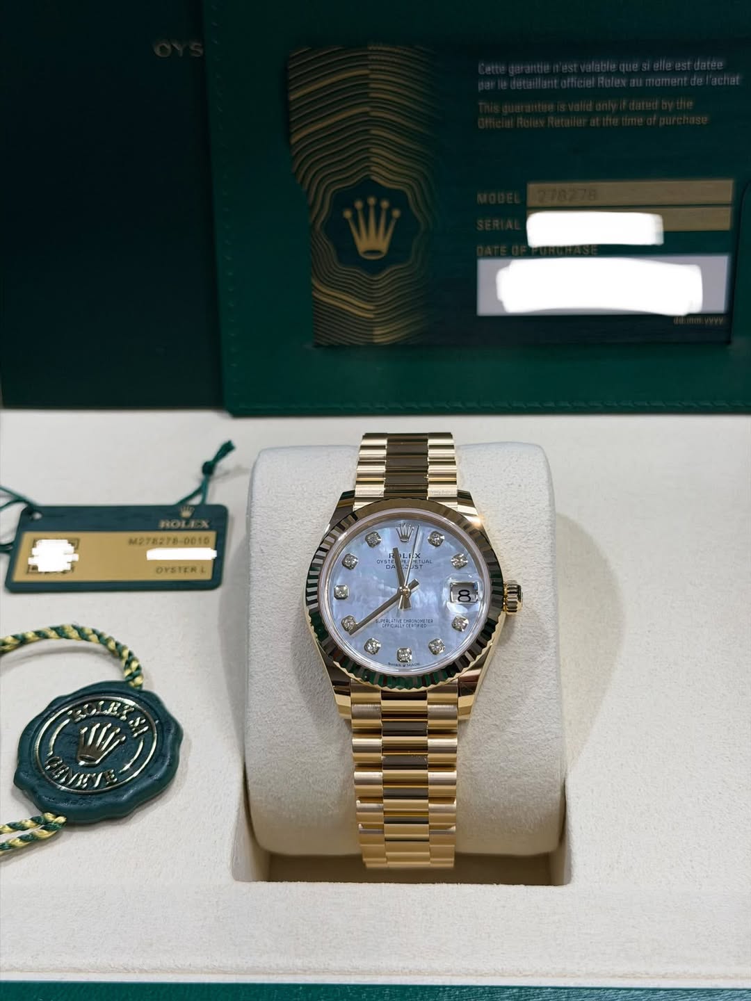 May be an image of wrist watch and text that says 'HOL M278278-0010 D010 OYSTERL 05 CA 64 ಶ್ರೀ'