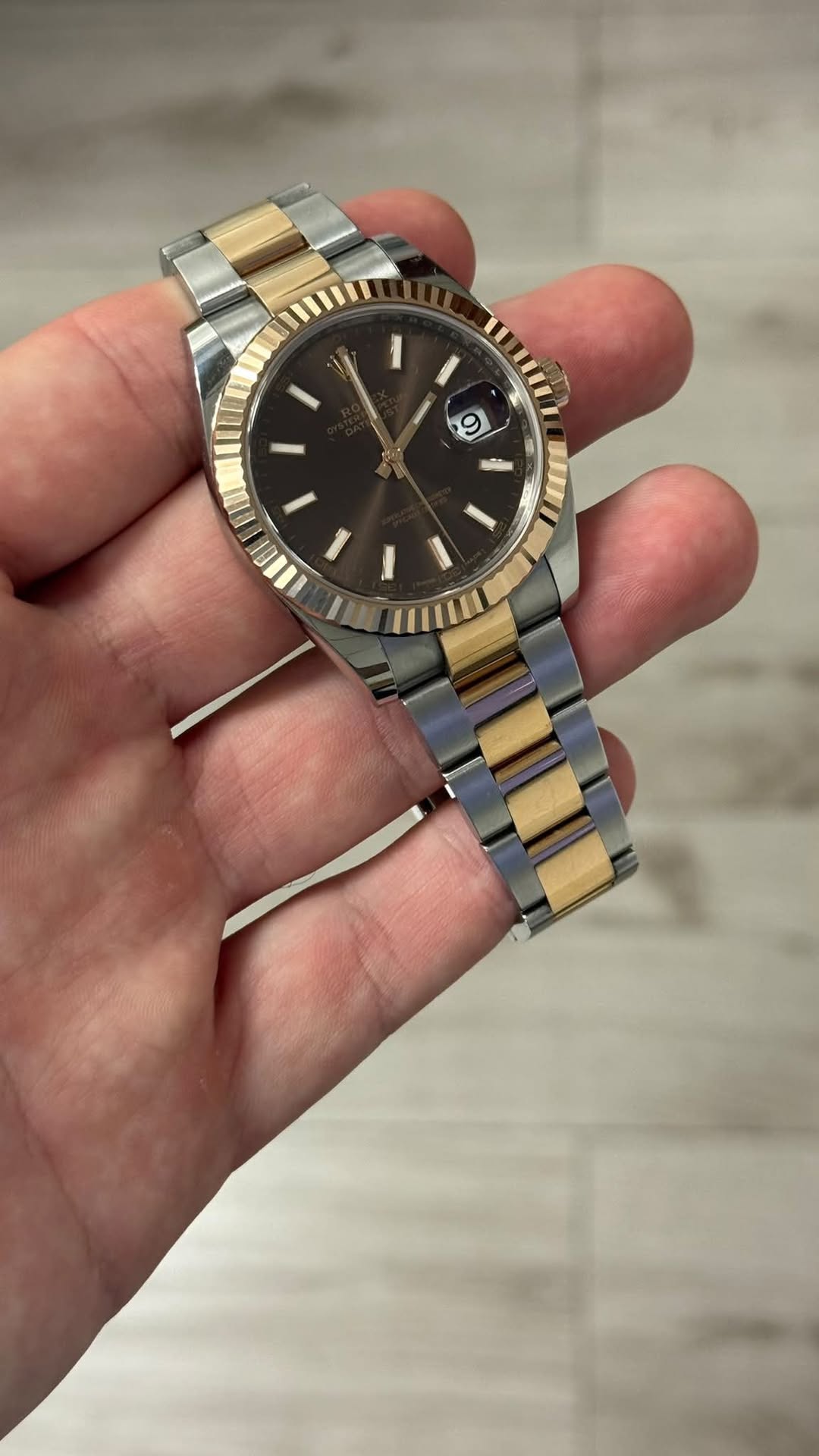 May be an image of wrist watch and text