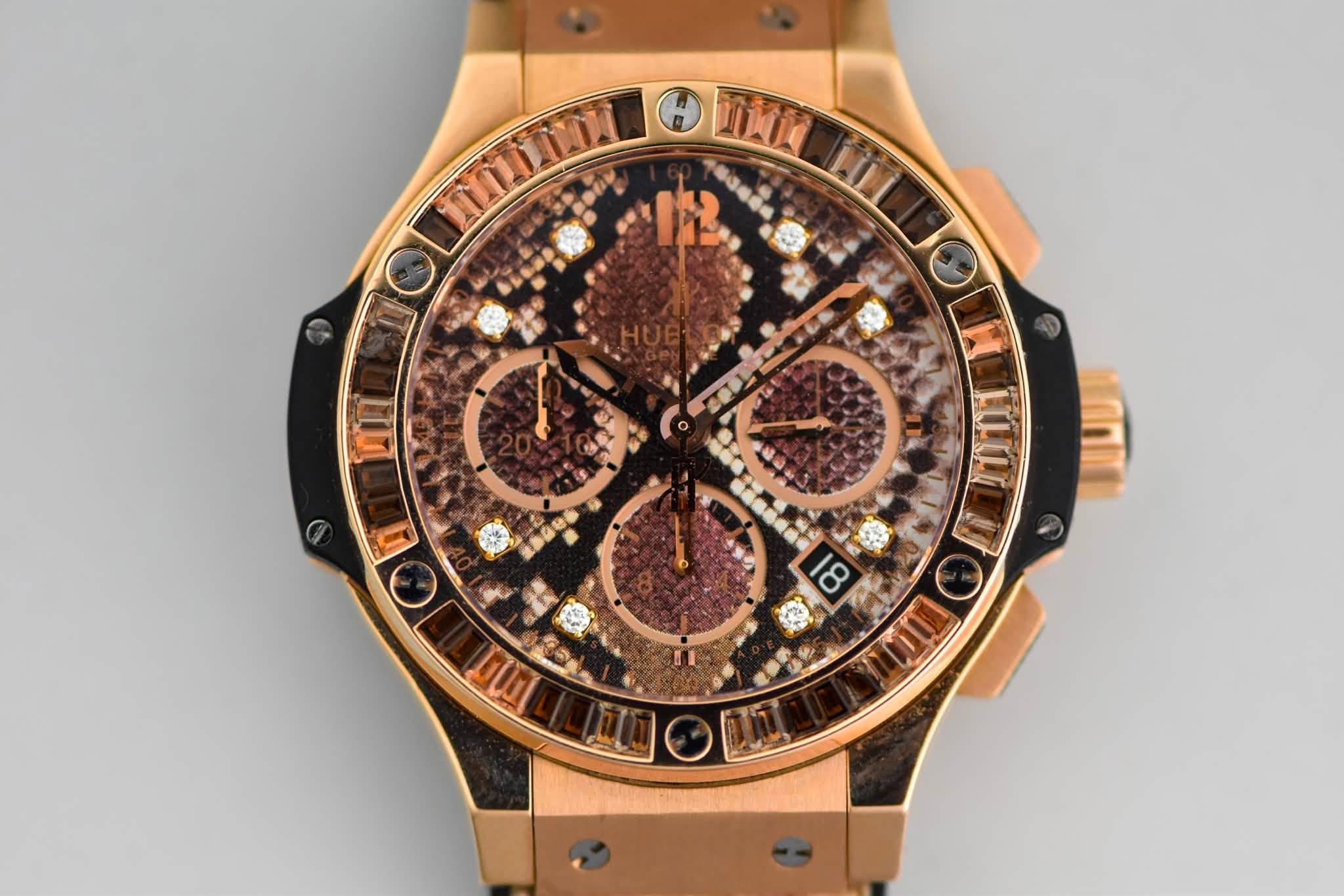May be an image of wrist watch and text