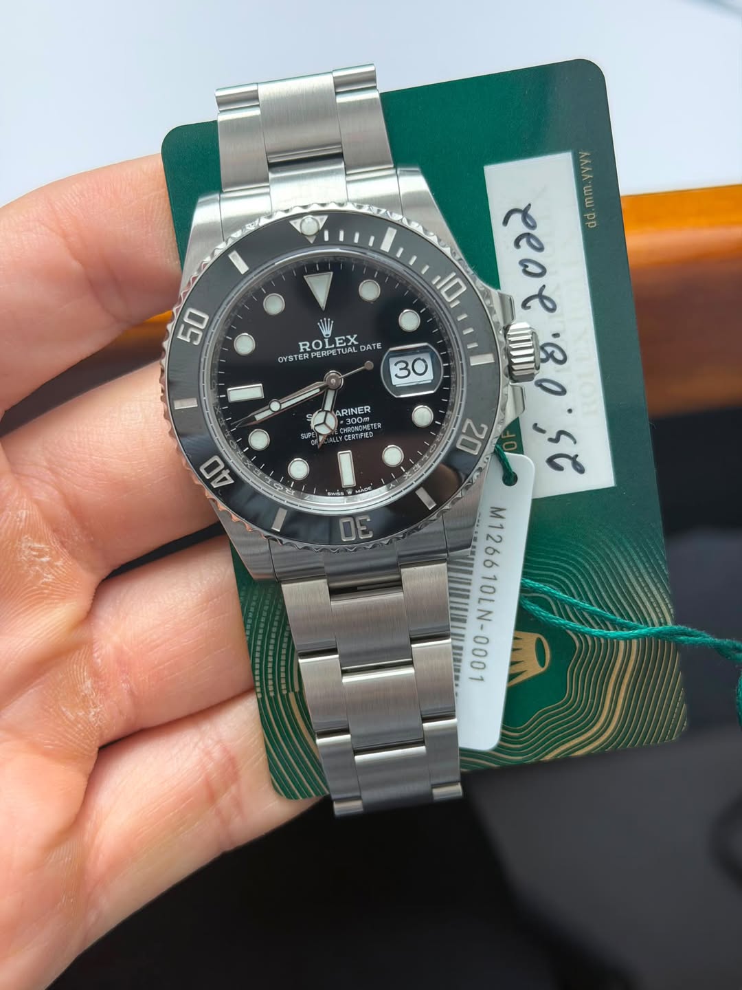 May be an image of wrist watch and text