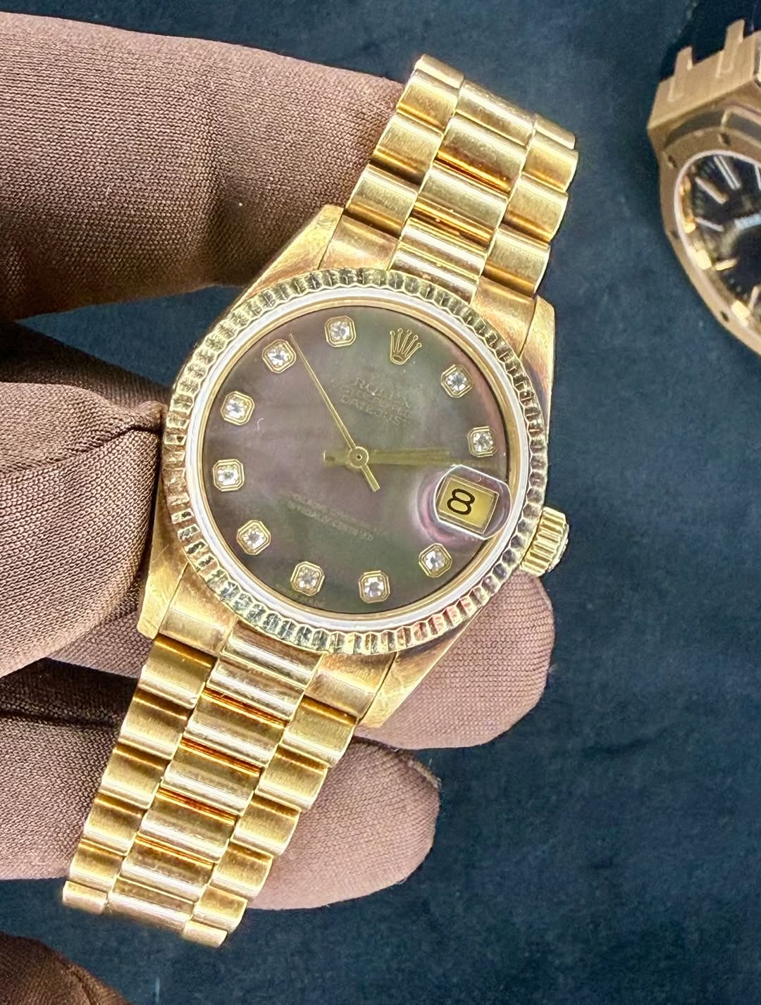 May be an image of wrist watch and text