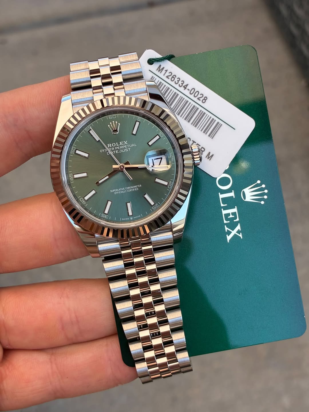 May be an image of wrist watch and text