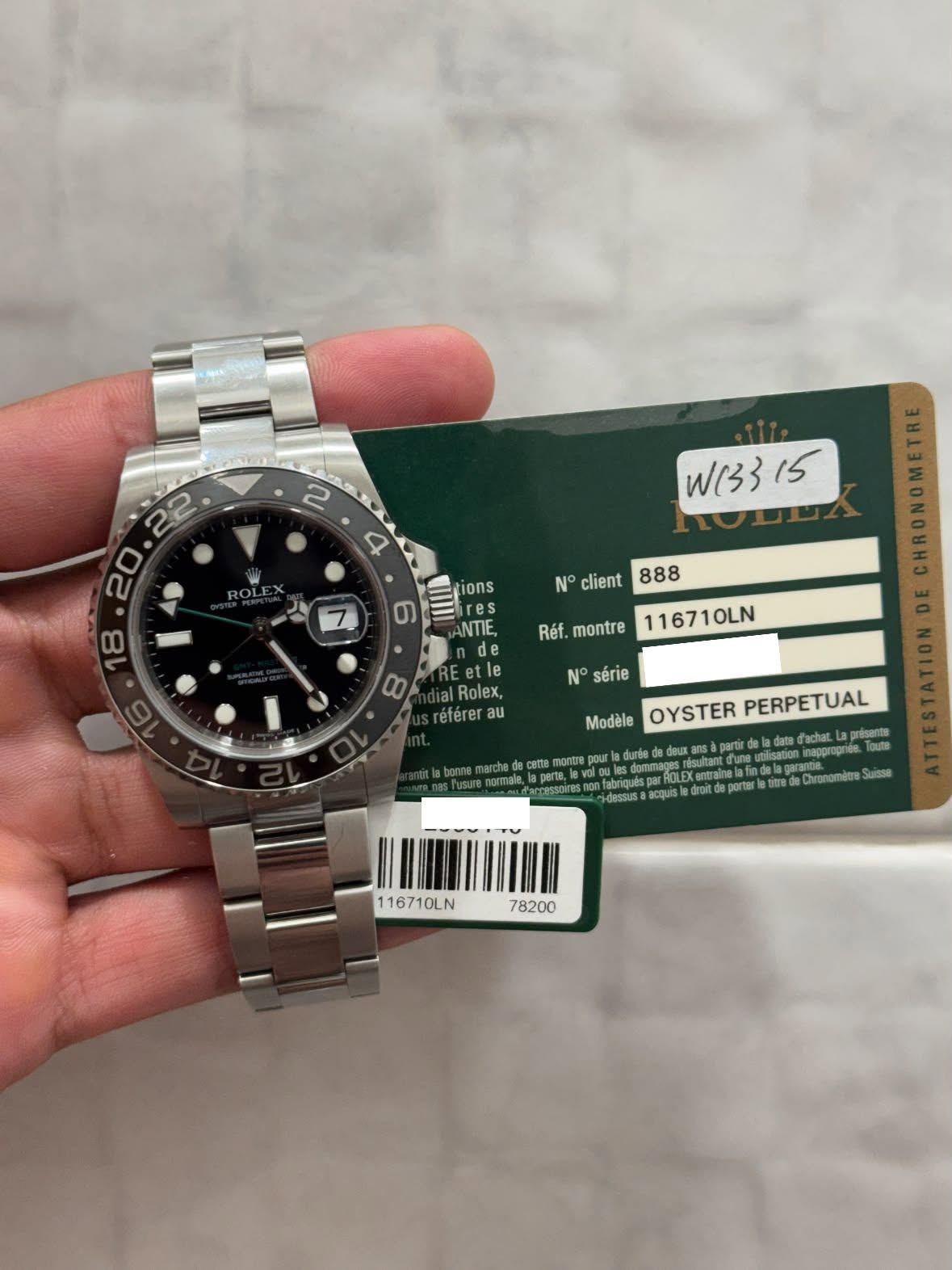 May be an image of wrist watch and text that says ' ROLE 22 20 Wy 33 15 tions res NTIE, တ N° client 888 Réf. montre 116710LN 00 N° série Eetle |Rolex, réferer au lbennemarche par…