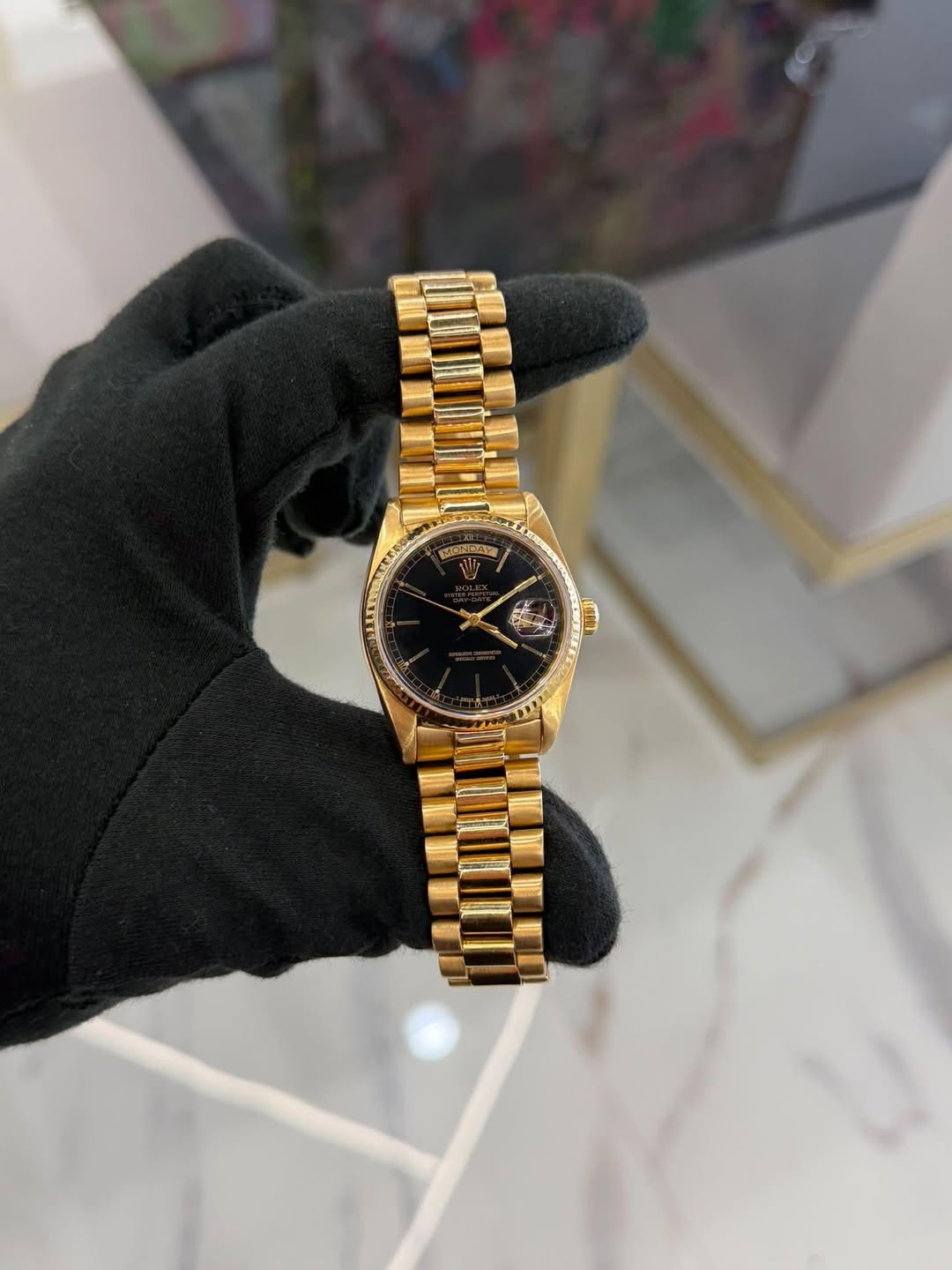 May be an image of wrist watch and text