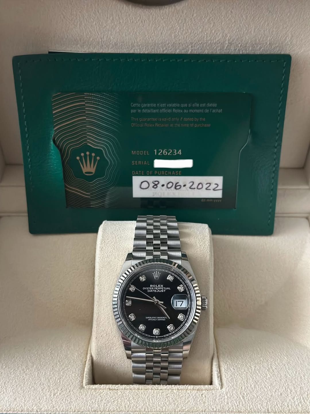 May be an image of wrist watch and text