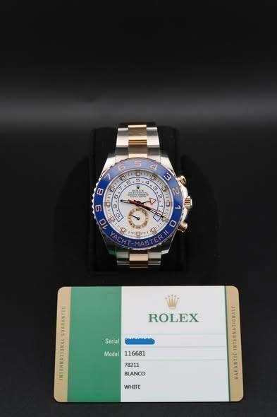 May be an image of wrist watch and text that says '8 -5.e OMLO 3 4 00 3 פלויז 2 4 L310 2 2 S דפר' 0 0 ROLEX Serial Model116681 Model BLANCO WHITE en GARANTIE'