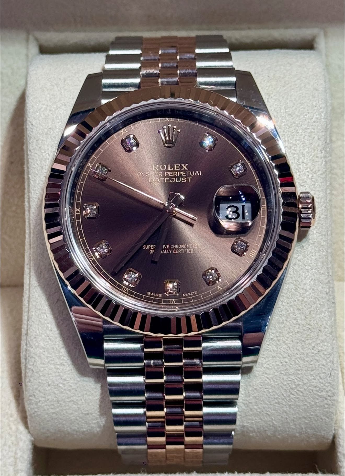 May be an image of wrist watch and text that says 'XI ROLEX PERPETUAL TUAL DATEJUST DAT SUPEF IVE CHRONOMET ALLYC ALLYCERTIFIED SUP CERTIFTED ALLY MADE'