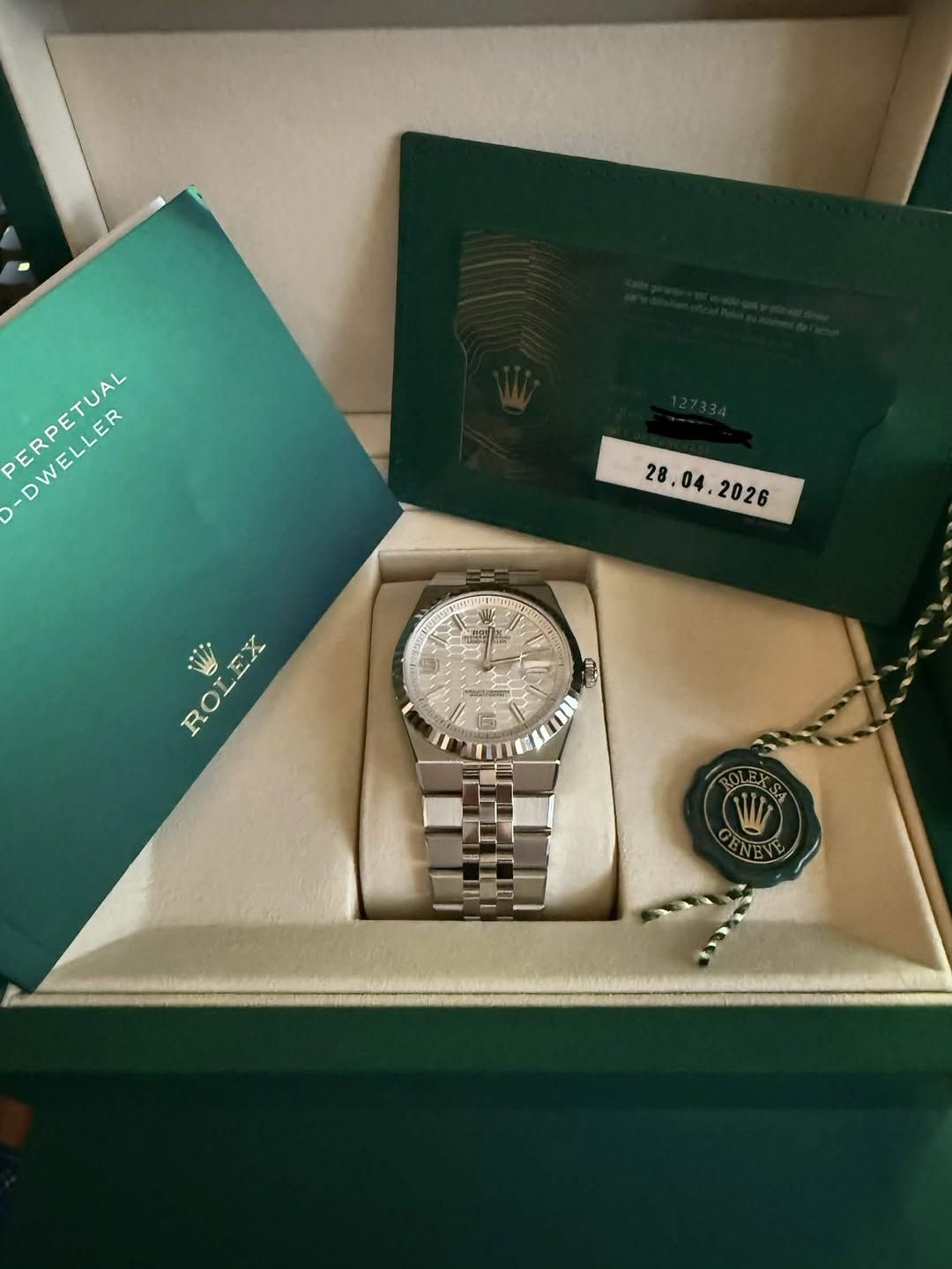 May be an image of wrist watch and text