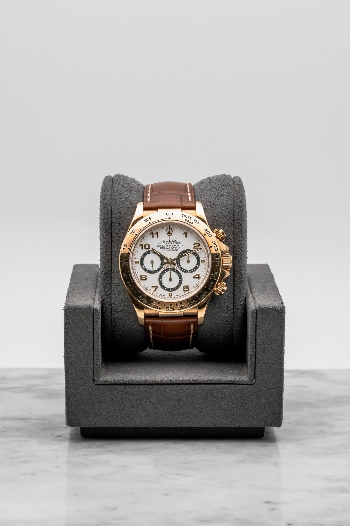 May be an image of owl, wrist watch, leather and text