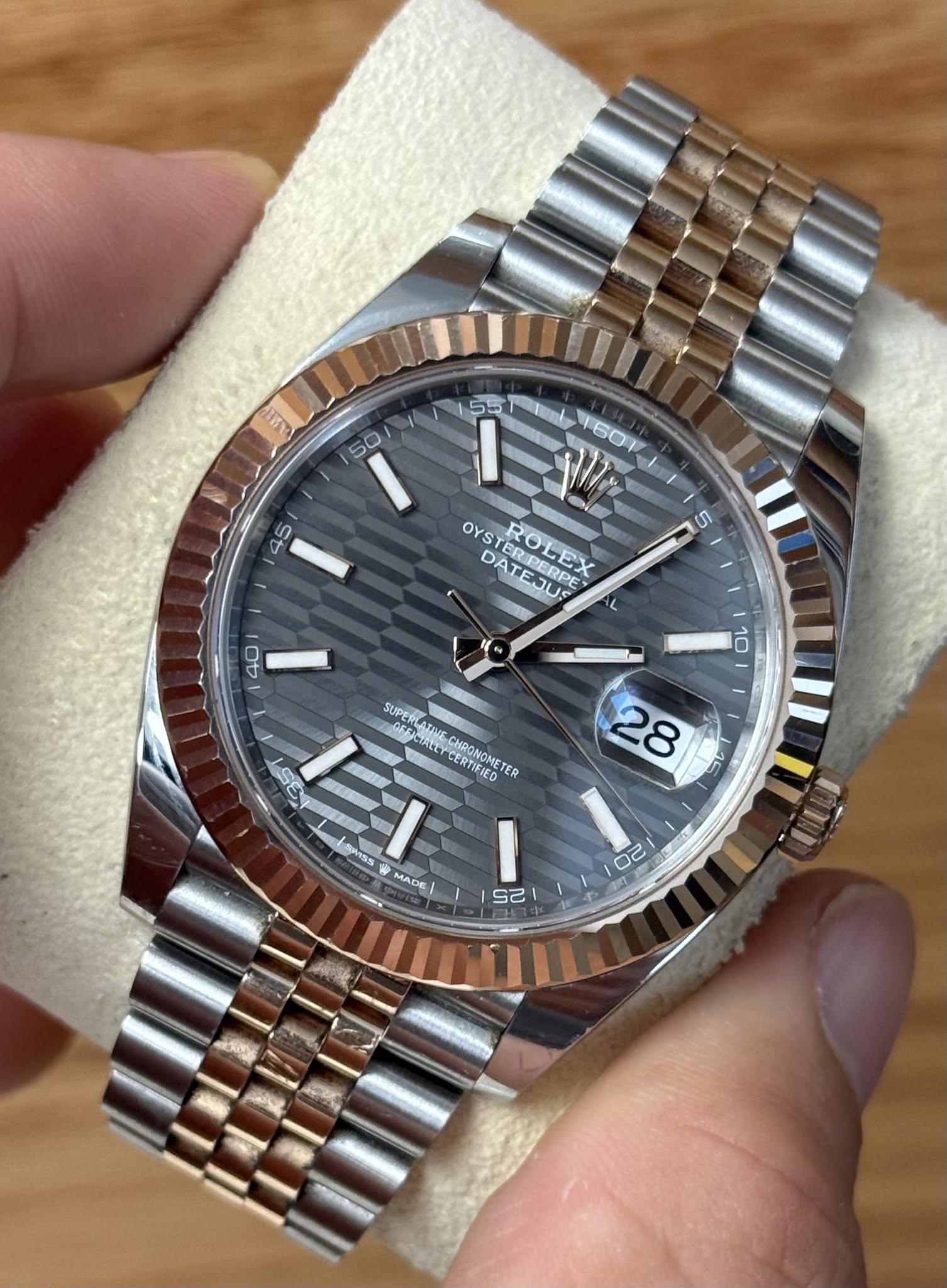 May be an image of wrist watch and text