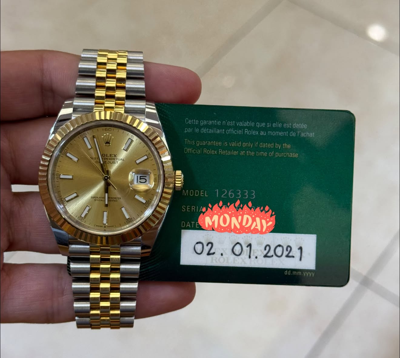 May be an image of wrist watch and text