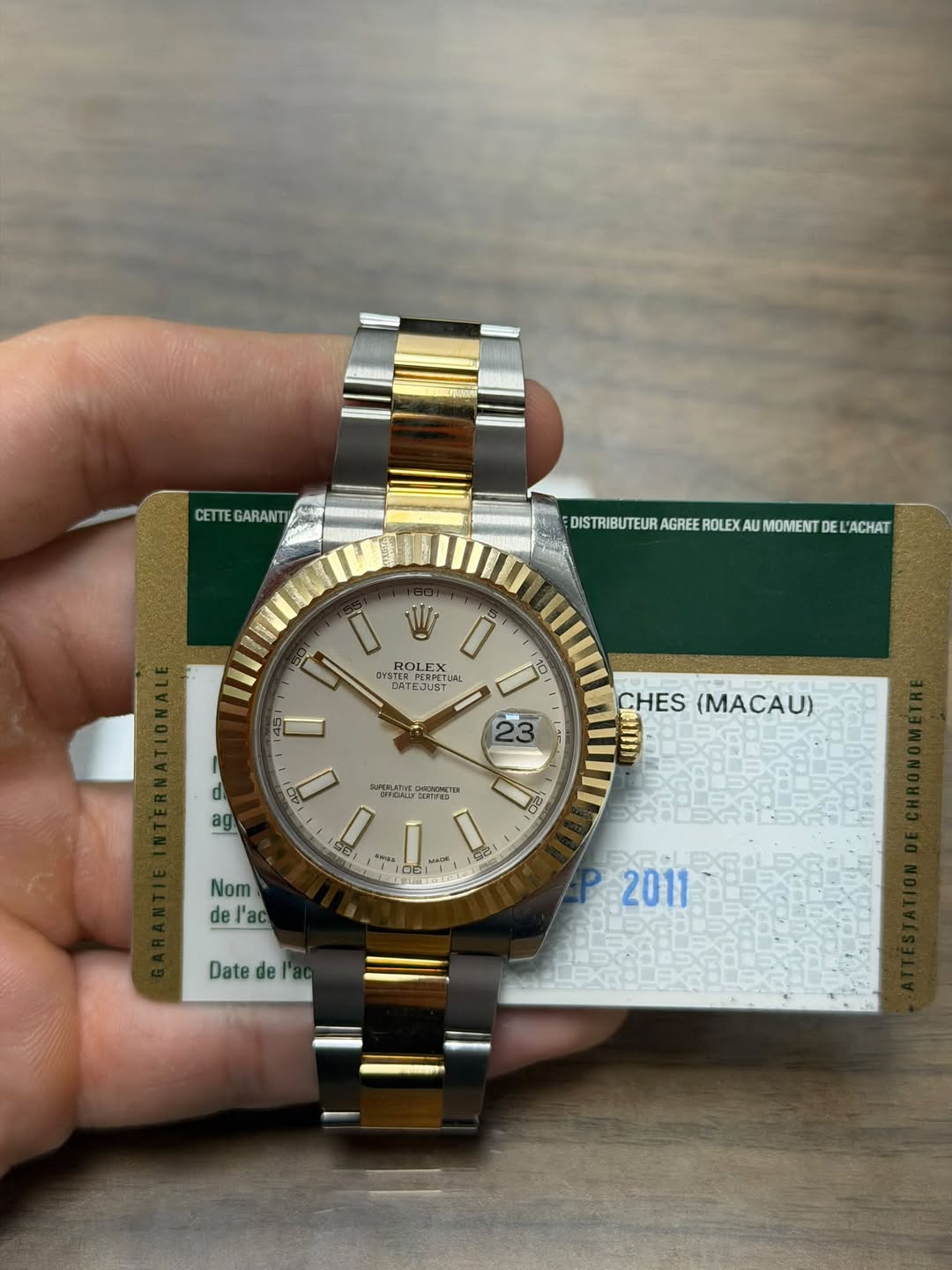 May be an image of wrist watch and text