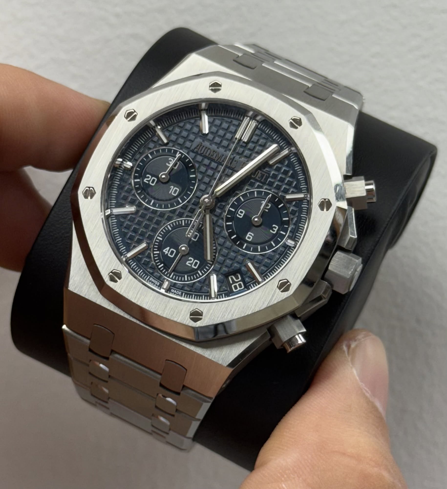 May be an image of wrist watch and text