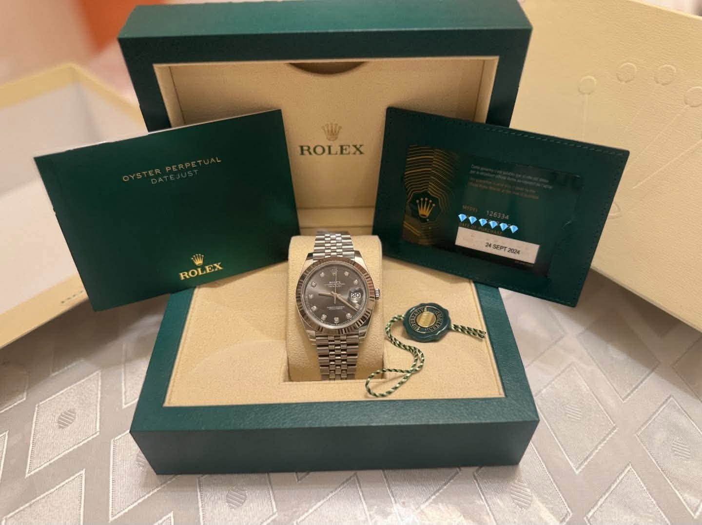 May be an image of wrist watch and text that says 'ROLEX ROLEX ROLEX 製 24SEPT2024 SEPT SEP PT 2024 T m E0 • বাচি'